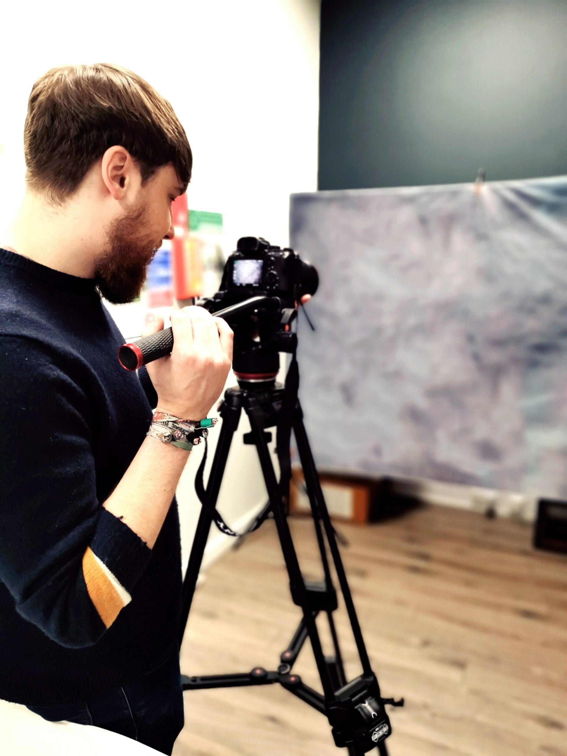 Photograph of Anthony Trantum mounting a camera to a tripod